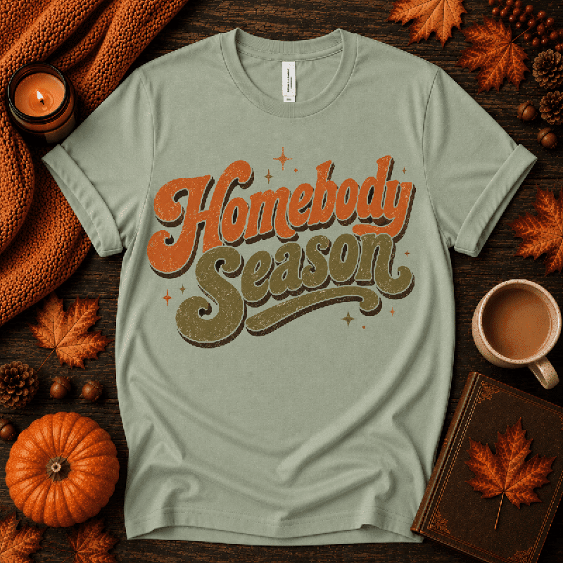 Homebody Season Premium T-Shirt in sage, flat lay with autumn props