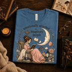 Imaginary People Premium T-Shirt in steel blue, folded close-up styled with books and glasses