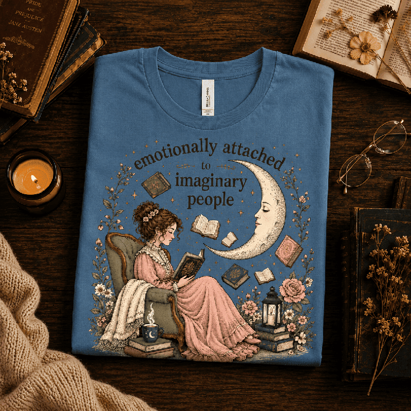 Imaginary People Premium T-Shirt in steel blue, folded close-up styled with books and glasses