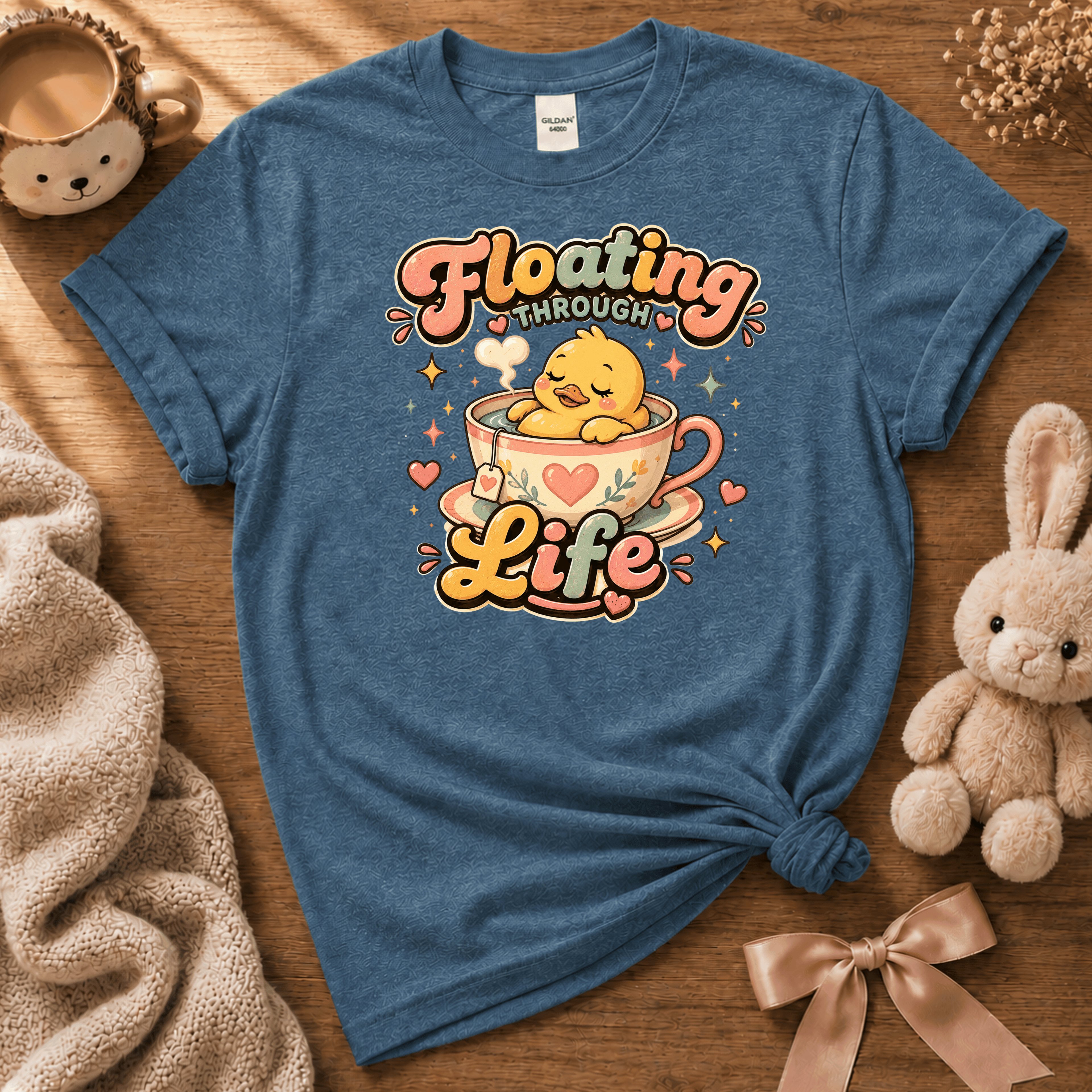 Floating Through Life cute animal graphic t-shirt cozy flat lay in indigo blue.