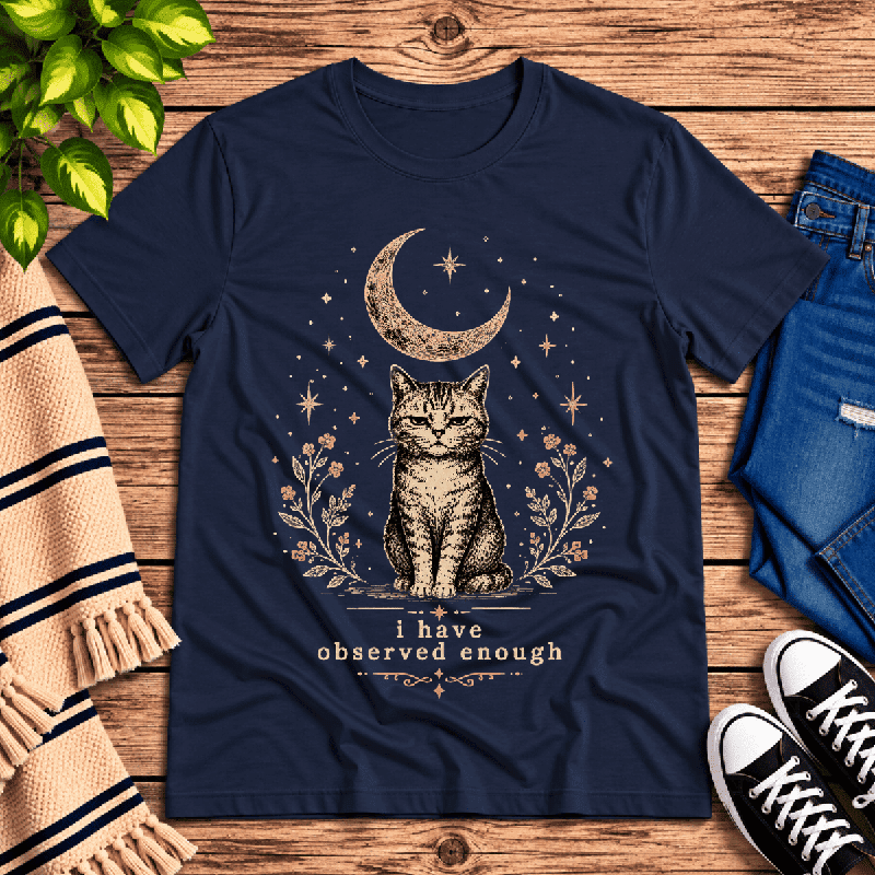 I've Observed Enough Premium T-Shirt in navy, flat lay with crescent moon, stars, and cat graphic