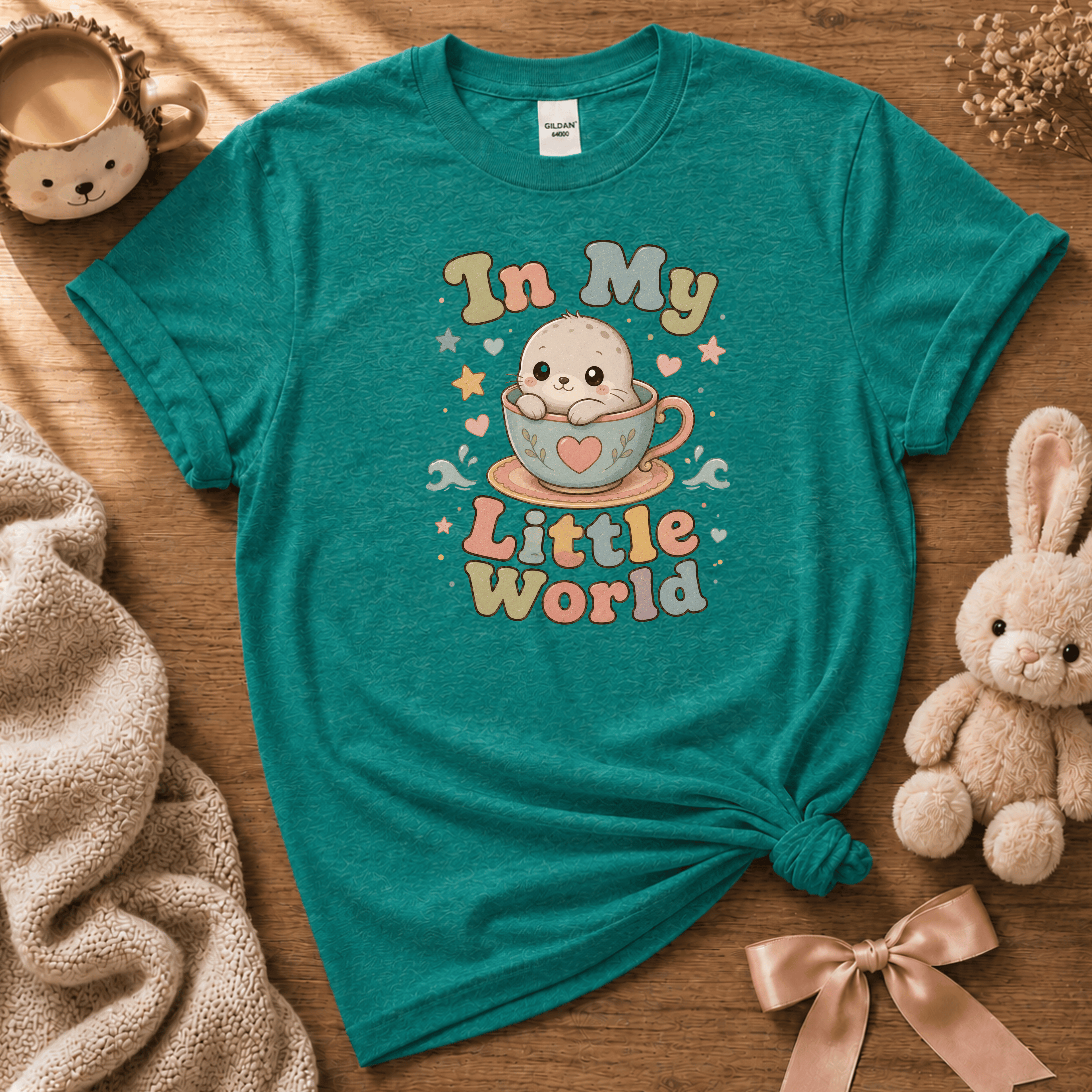 In My Little World cute animal graphic t-shirt displayed in a cozy flat lay in jade dome.