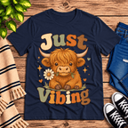 Just Vibing Cow Premium T-Shirt in navy, flat lay