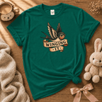 Winging it cute animal graphic t-shirt cozy flat lay in kelly green.