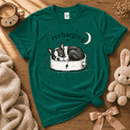 Boston Recharging cute animal graphic t-shirt displayed in a cozy flat lay in kelly green.