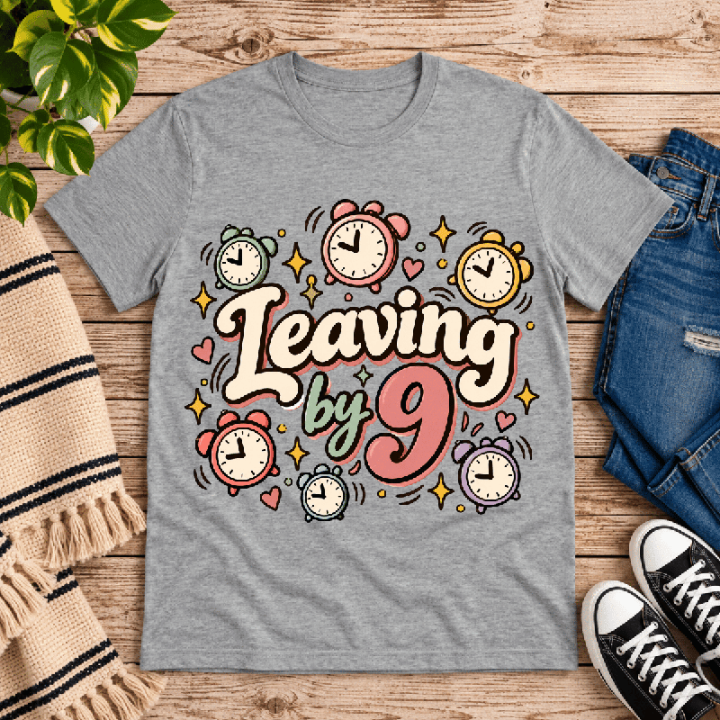 Leaving by 9 Premium T-Shirt in athletic heather gray, flat lay with alarm clocks, stars, and hearts graphic