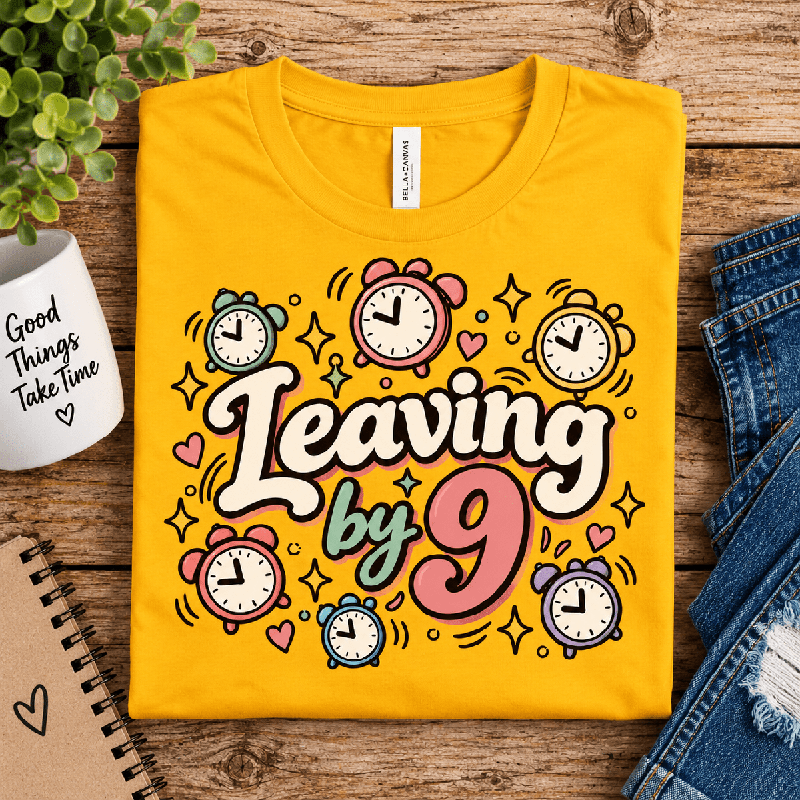 Leaving by 9 Premium T-Shirt in gold, folded close-up with neck tag showing