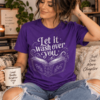 Woman holding a mug, wearing the Let It Wash Over You Premium T-Shirt in team purple