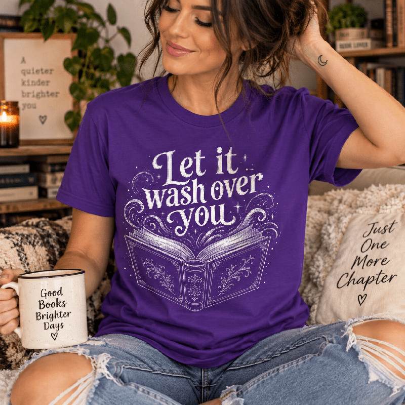 Woman holding a mug, wearing the Let It Wash Over You Premium T-Shirt in team purple
