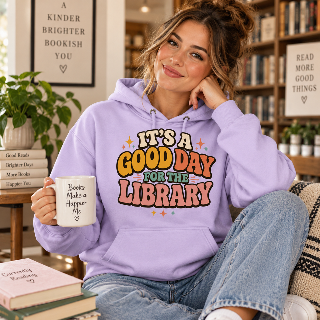 A woman wearing a lilac It's A Good Day cute book graphic hoodie.