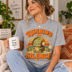 A woman wearing an athletic heather Running on Silence graphic t-shirt.