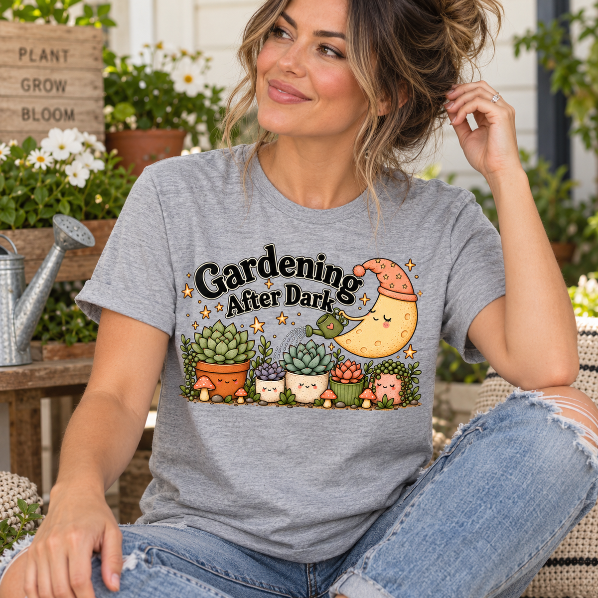 A woman wearing an athletic heather Gardening After Dark cute cottagecore graphic t-shirt.