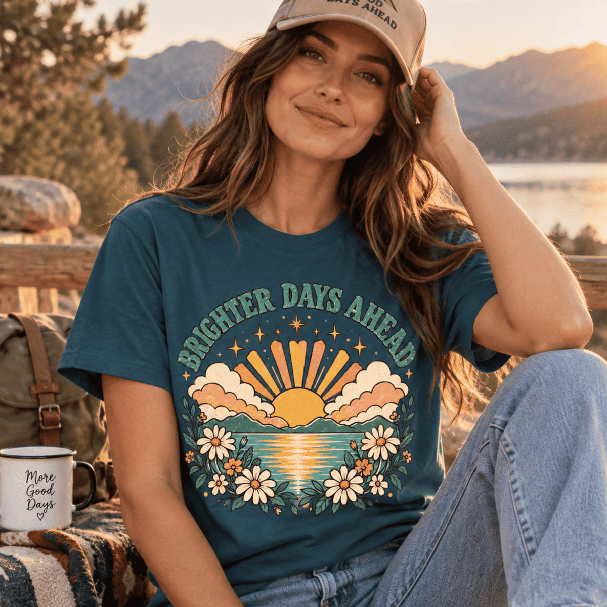 A woman wearing a deep teal Brighter Days Ahead inspirational introvert graphic t-shirt.