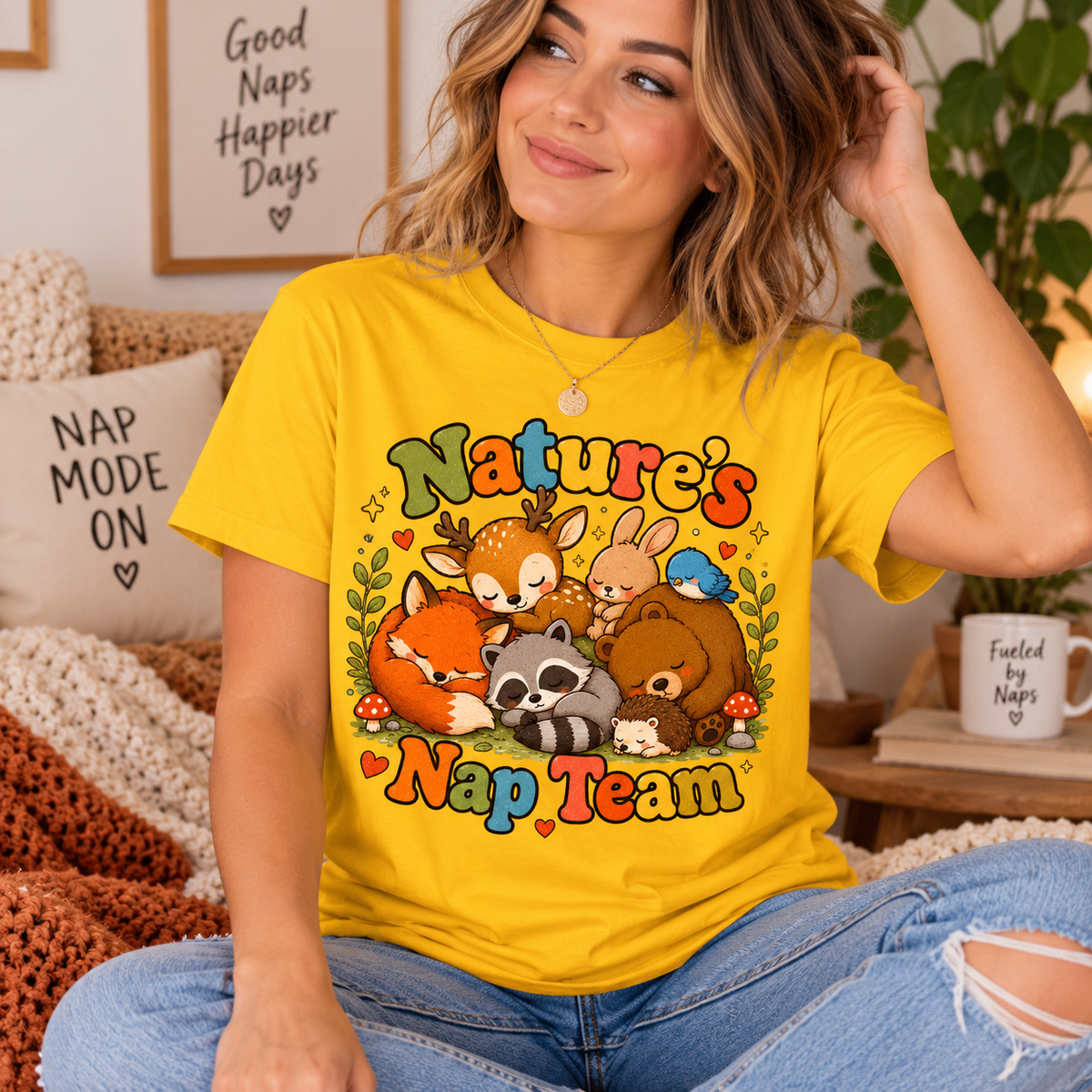 A woman wearing a gold Nature's Nap Team cute animal graphic t-shirt.