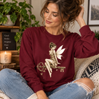 A woman wearing a maroon Key Fairy pinup fairy graphic long sleeve t-shirt.