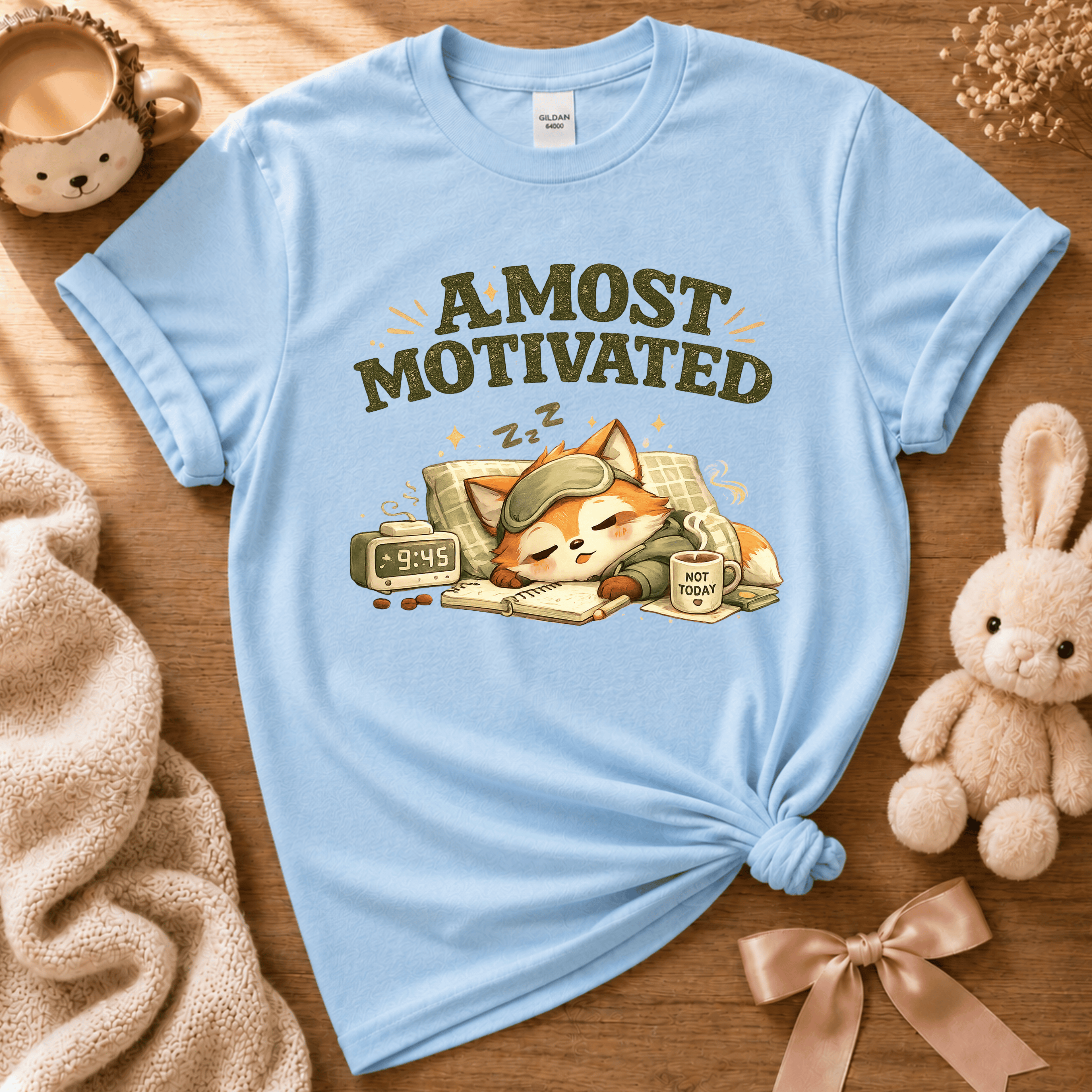 Almost Motivated introvert graphic t-shirt cozy flat lay in light blue.