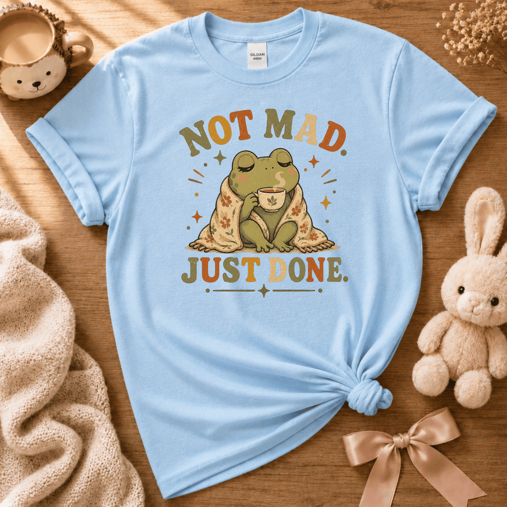 Just Done cute animal graphic t-shirt displayed in a cozy flat lay in light blue.