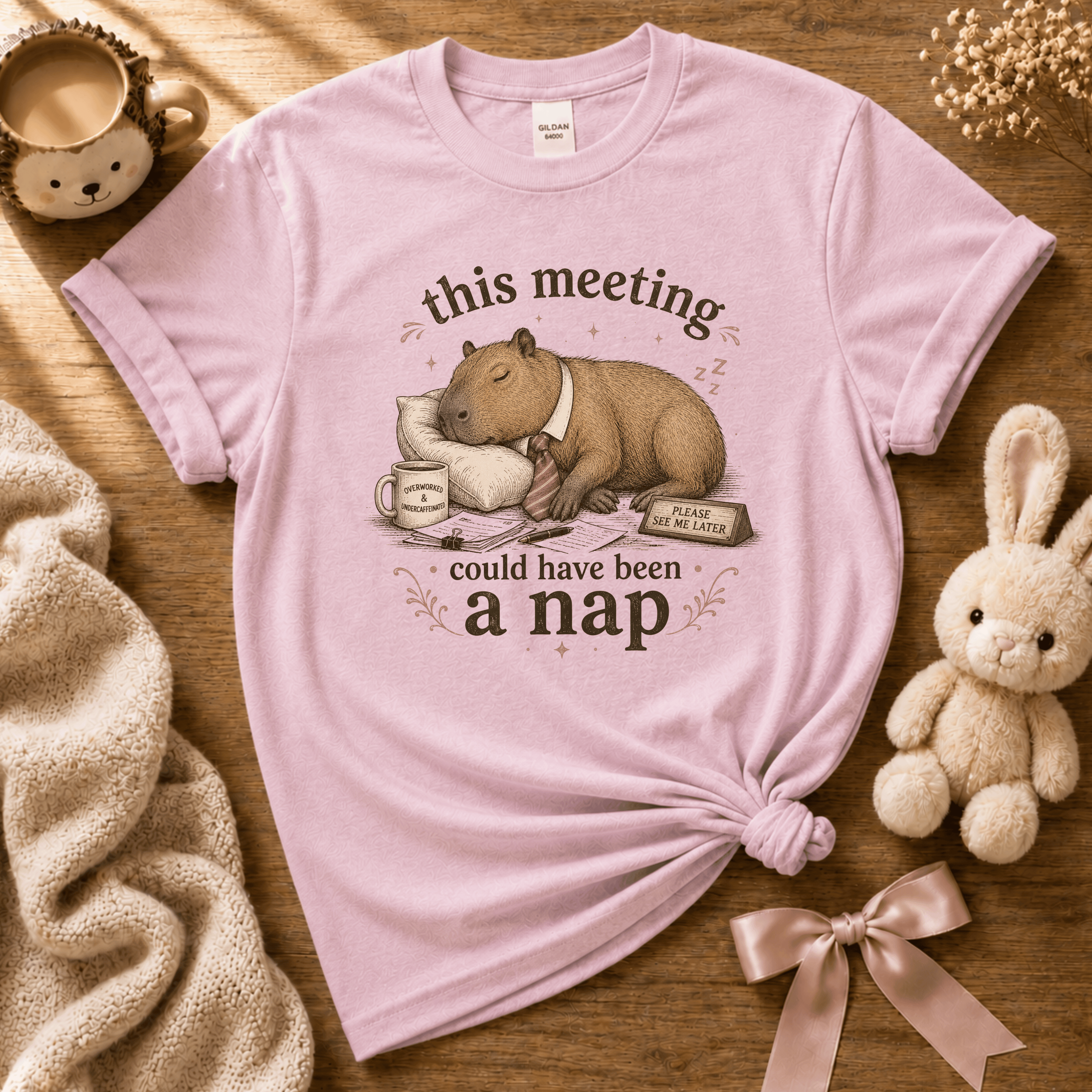This Meeting cute animal graphic t-shirt cozy flat lay in light pink.