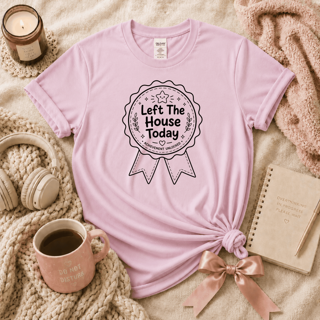 Left The House introvert graphic t-shirt cozy flat lay in light pink.