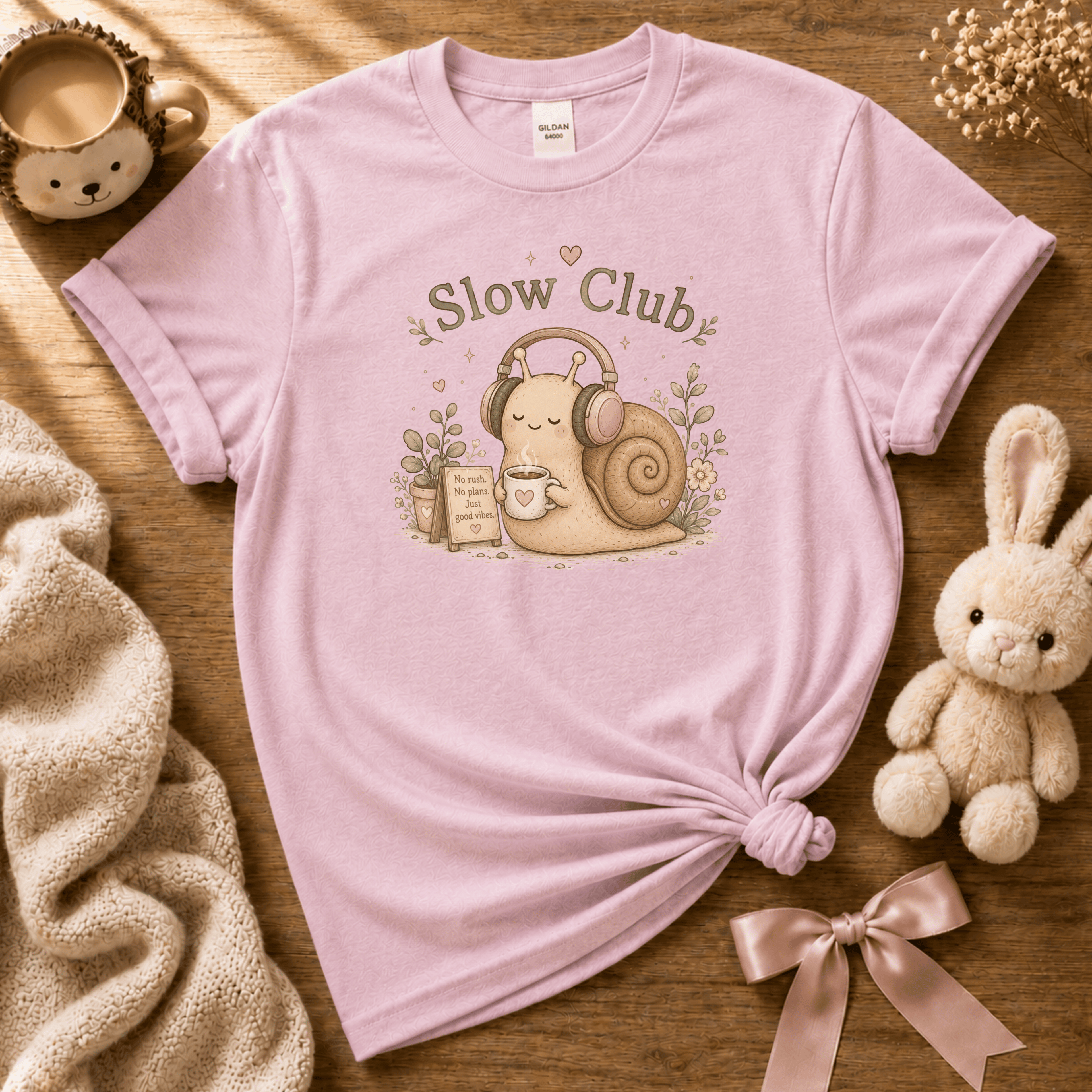 Slow Club cute animal graphic t-shirt cozy flat lay in light pink.
