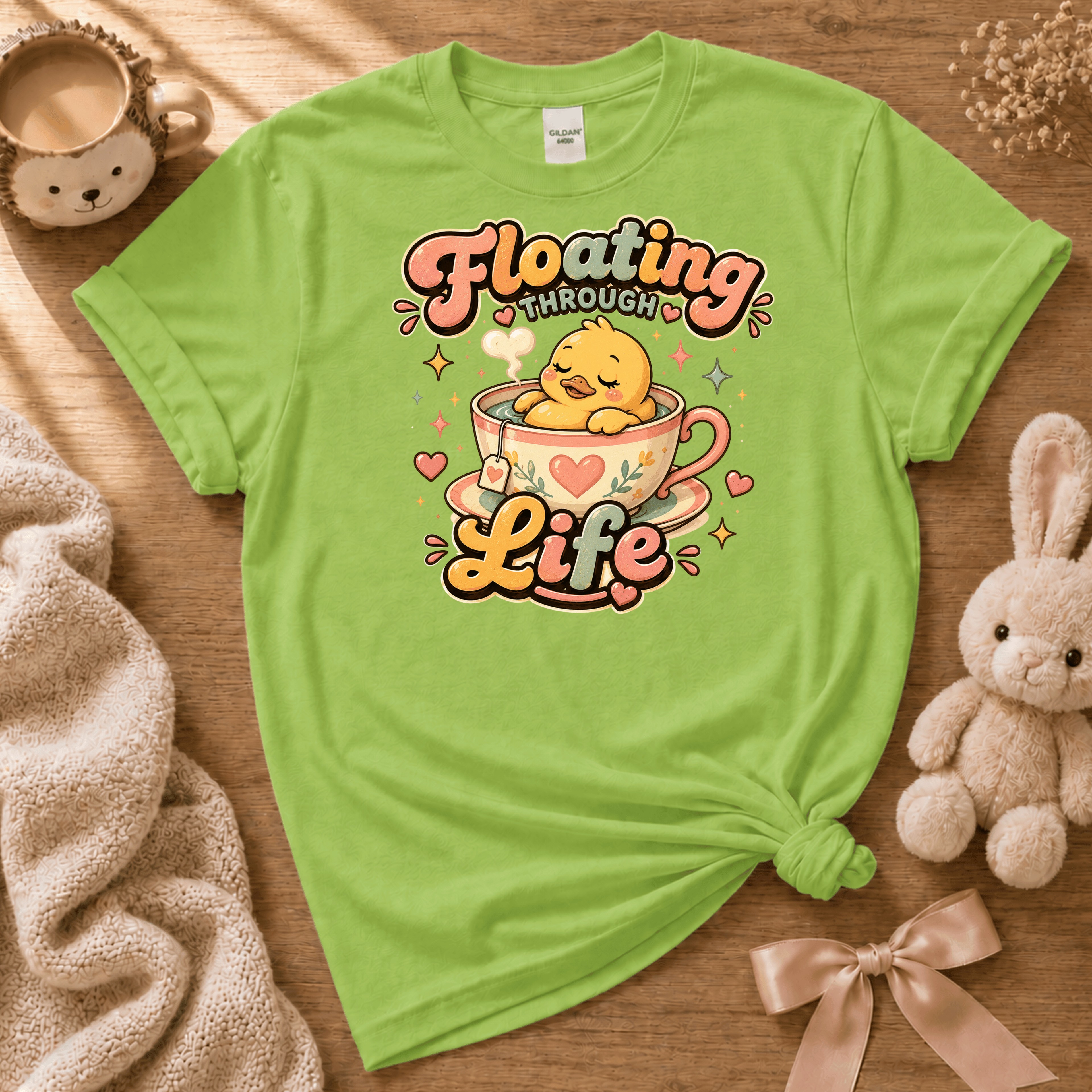 Floating Through Life cute animal graphic t-shirt cozy flat lay in lime green.