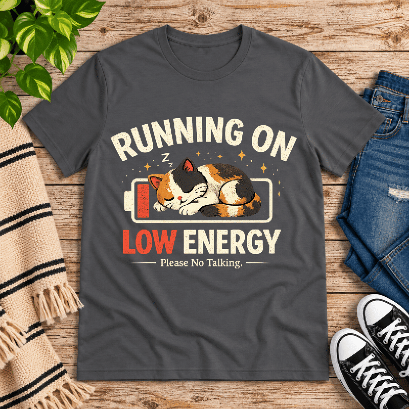 Low Energy Cat Premium T-Shirt in asphalt gray, flat lay with sleeping calico cat in a low-battery icon graphic