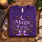 Magic First Premium T-Shirt in team purple, folded close-up with neck tag showing