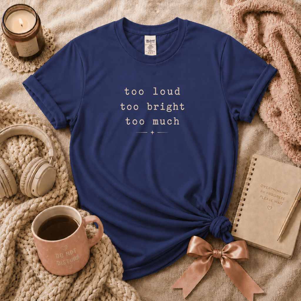 Too Much introvert graphic t-shirt cozy flat lay in metro blue.