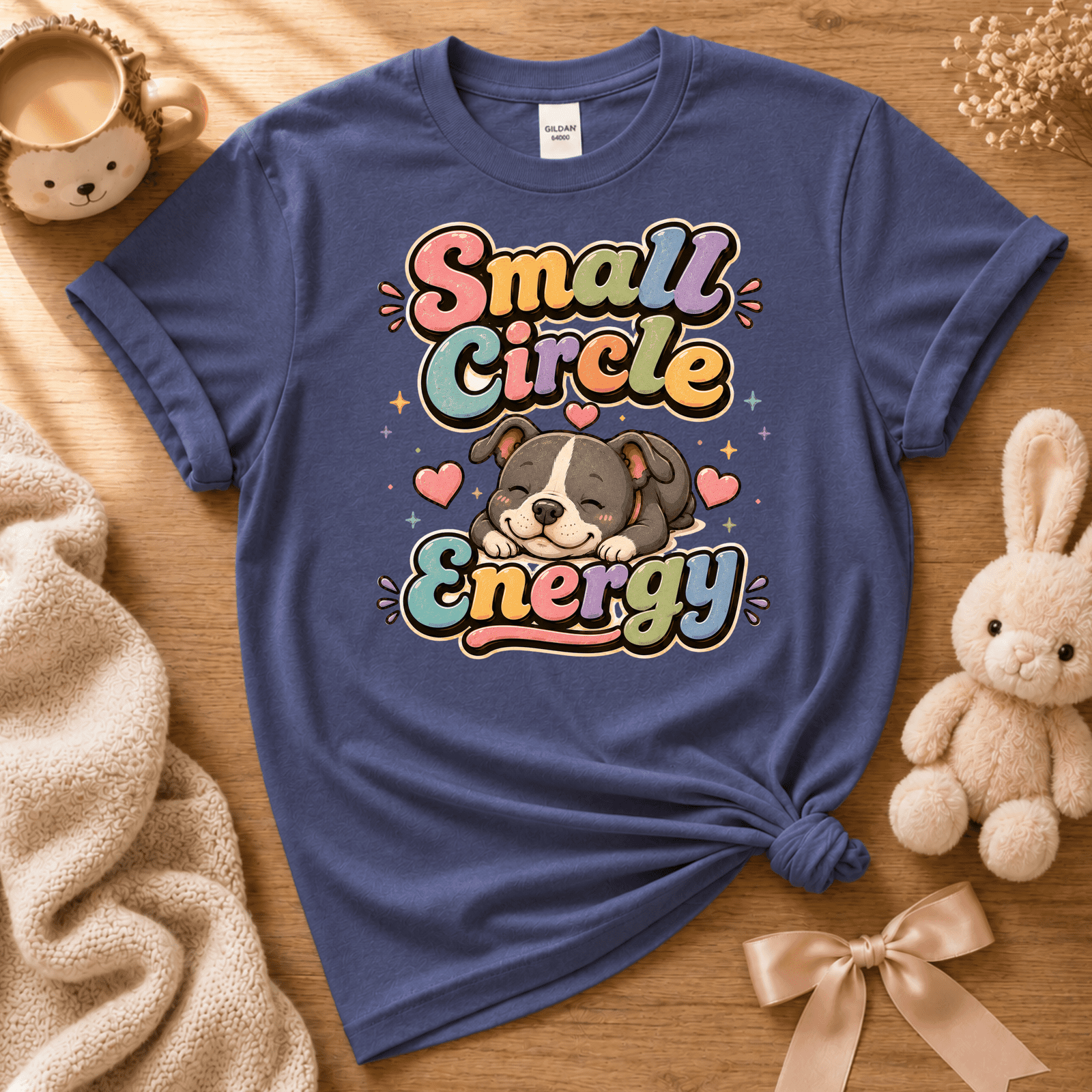 Small circle energy cute animal graphic t-shirt displayed in a cozy flat lay in metro blue.