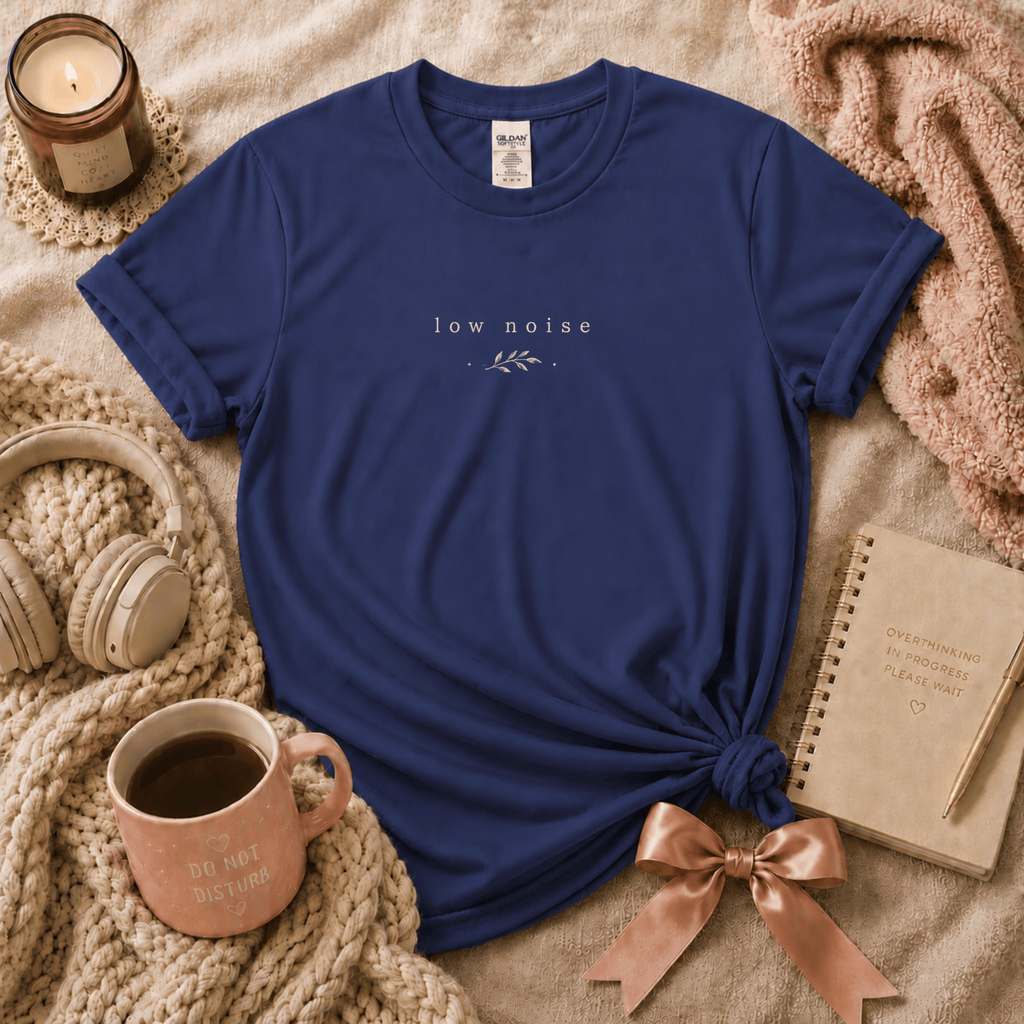 Low Noise introvert graphic t-shirt cozy flat lay in metro blue.