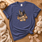 Winging it cute animal graphic t-shirt displayed in a cozy flat lay in metro blue.