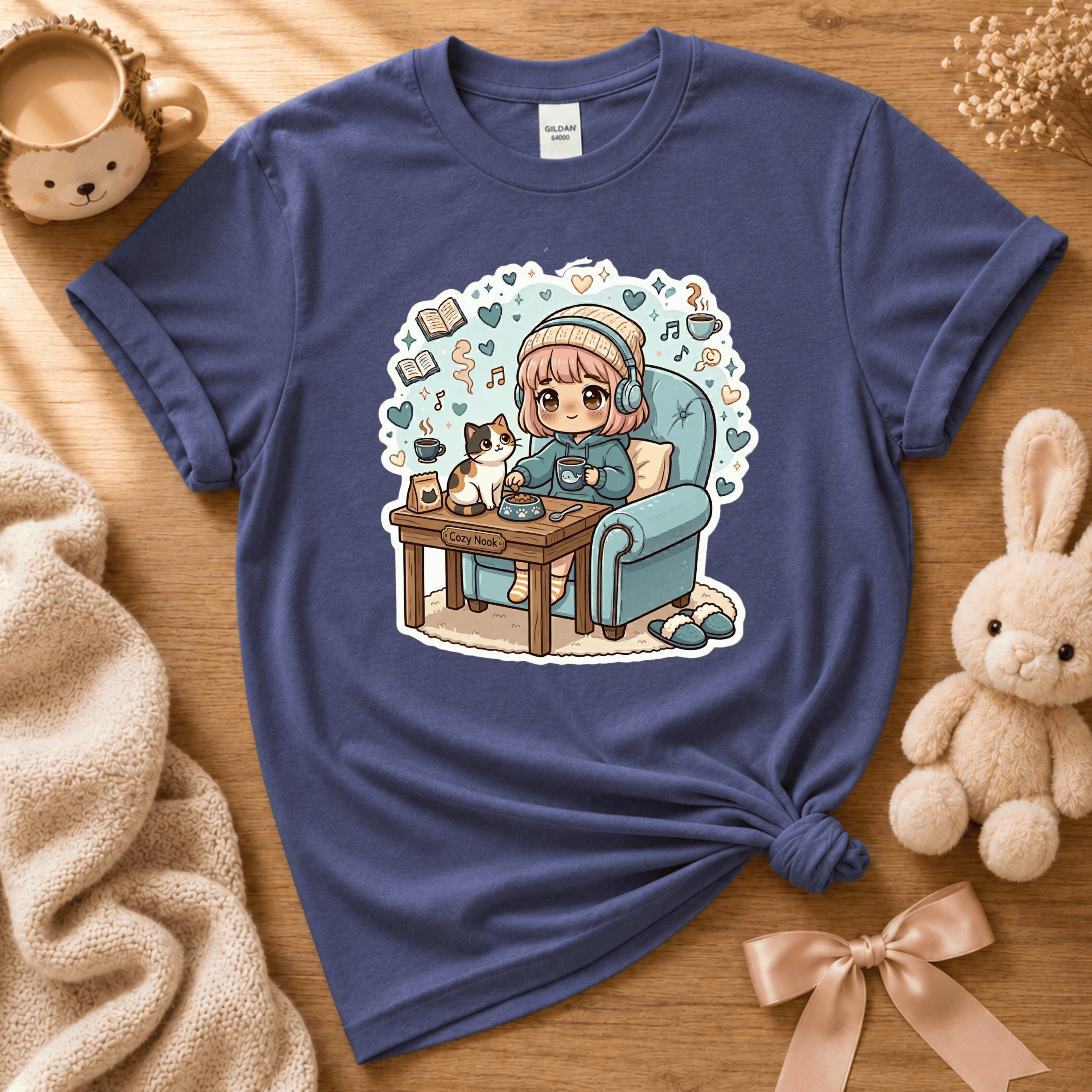 Cat Cozy Nook cute animal graphic t-shirt cozy flat lay in metro blue.