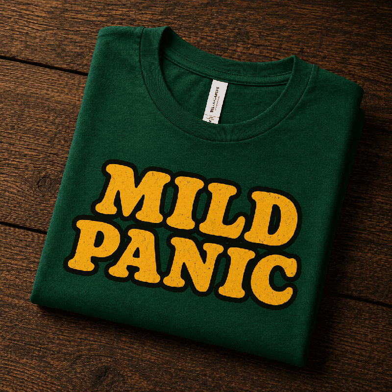 Mild Panic Premium T-Shirt in evergreen, folded close-up with neck tag showing