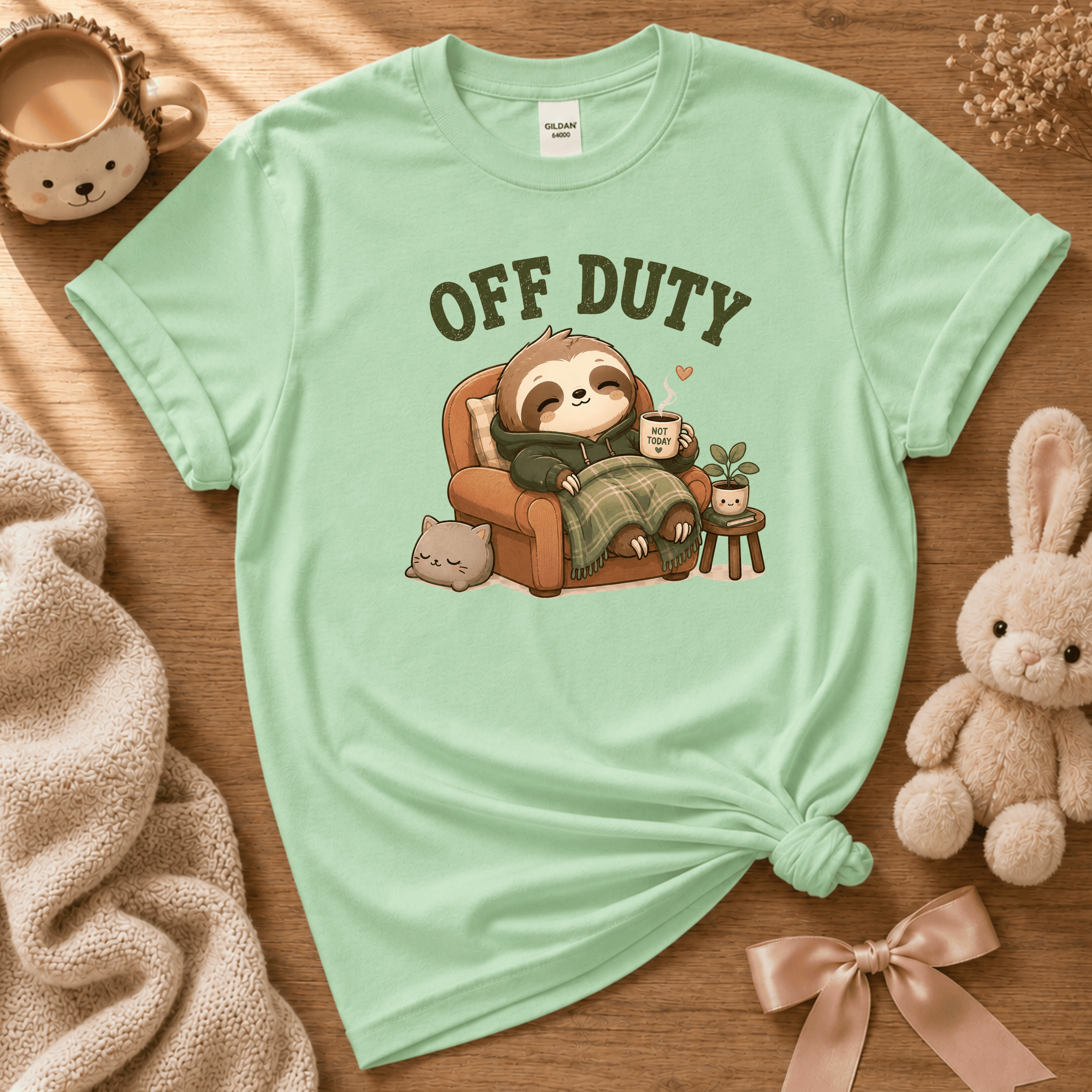 Off Duty cute animal graphic t-shirt cozy flat lay in mint green.