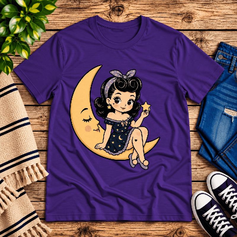 Moonlight Millie Premium T-Shirt in team purple, flat lay with girl sitting on a crescent moon holding a star graphic