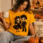 Woman holding a mug, wearing the Mr. & Mrs. Premium T-Shirt in gold