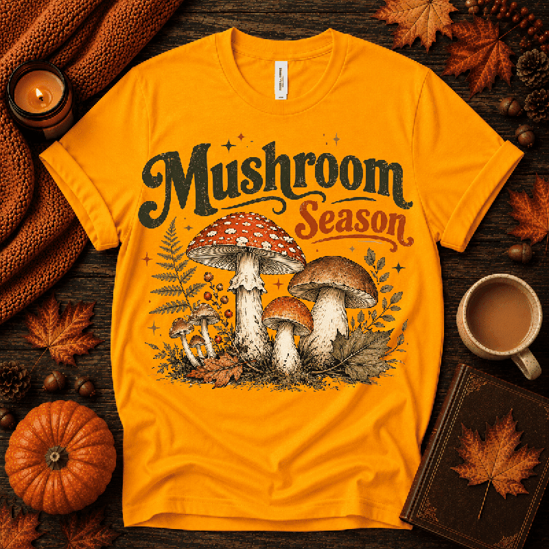 Mushroom Season Premium T-Shirt in gold, flat lay with autumn props