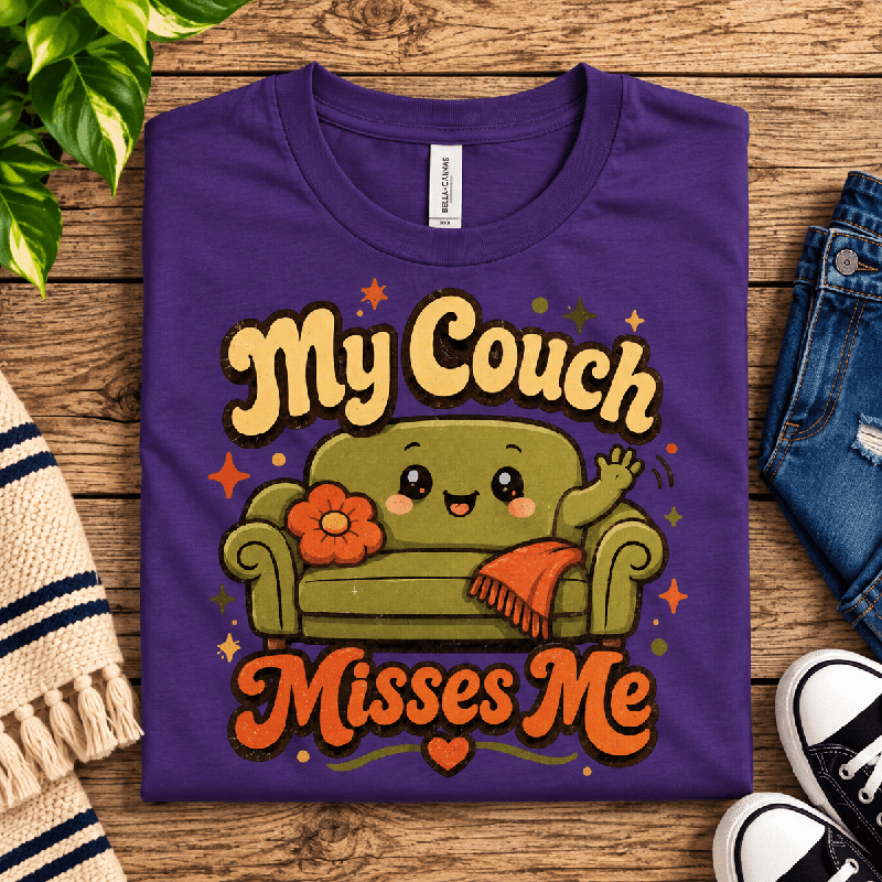 My Couch Misses Me Premium T-Shirt in team purple, folded close-up with neck tag showing