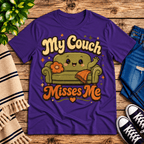 My Couch Misses Me Premium T-Shirt in team purple, flat lay with smiling cartoon couch graphic