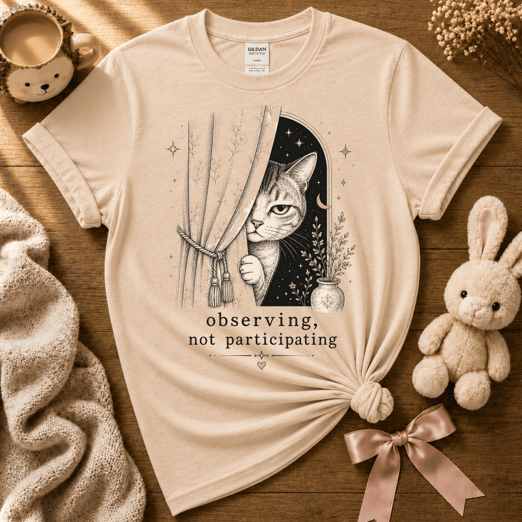 Observing introvert graphic t-shirt displayed in a cozy flat lay in natural.