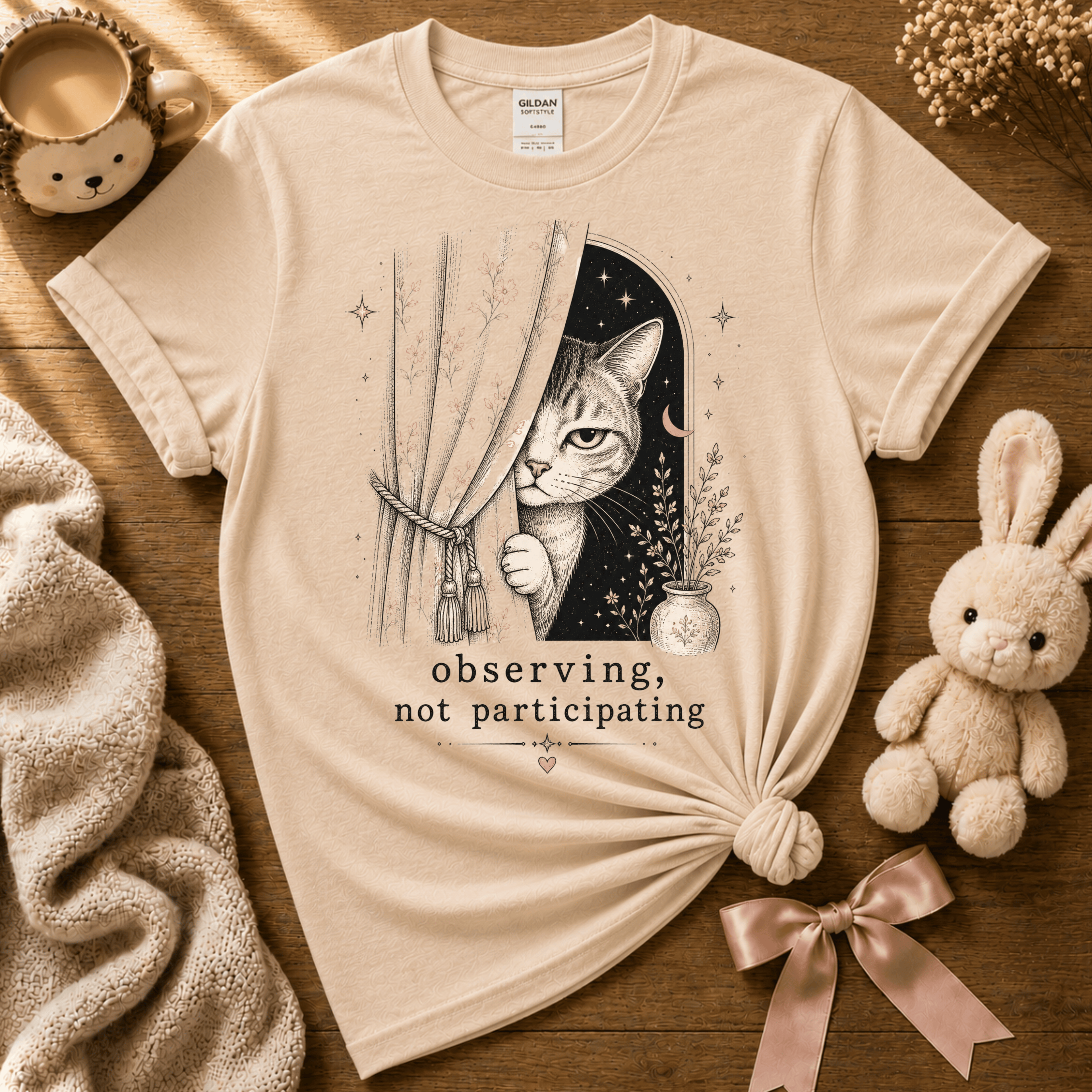 Observing introvert graphic t-shirt displayed in a cozy flat lay in natural.
