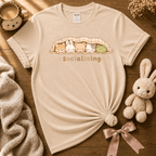 Socializing Animals cute animal graphic t-shirt displayed in a cozy flat lay in natural.