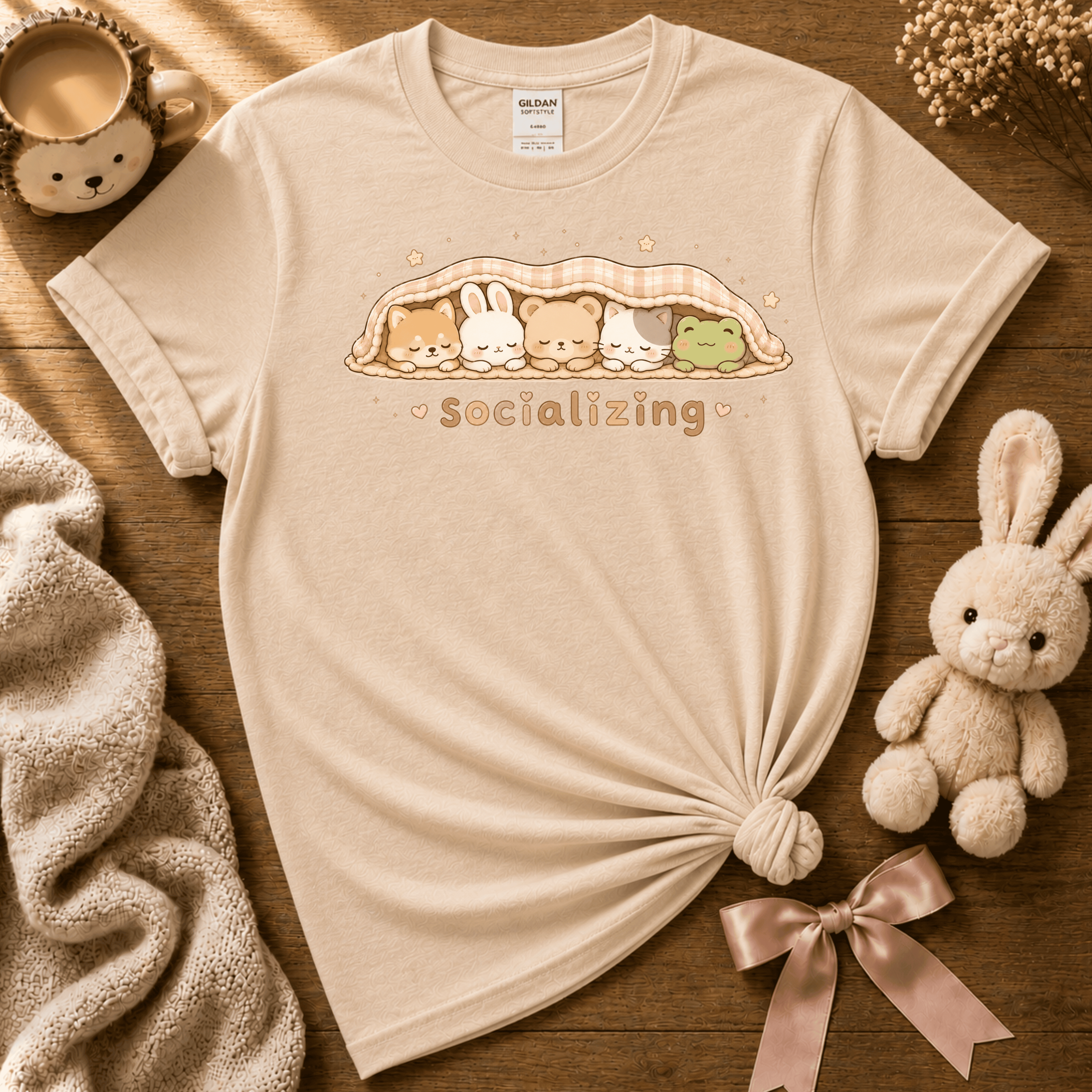 Socializing Animals cute animal graphic t-shirt displayed in a cozy flat lay in natural.