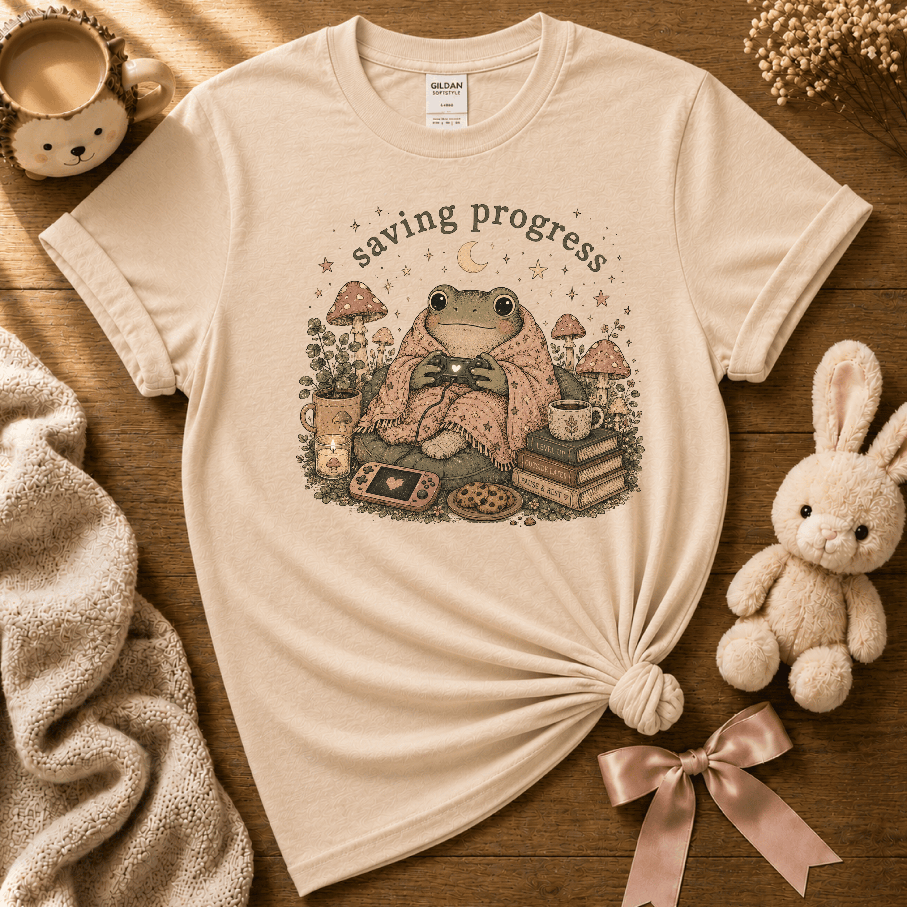 Saving Progress cute animal graphic t-shirt displayed in a cozy flat lay in natural.