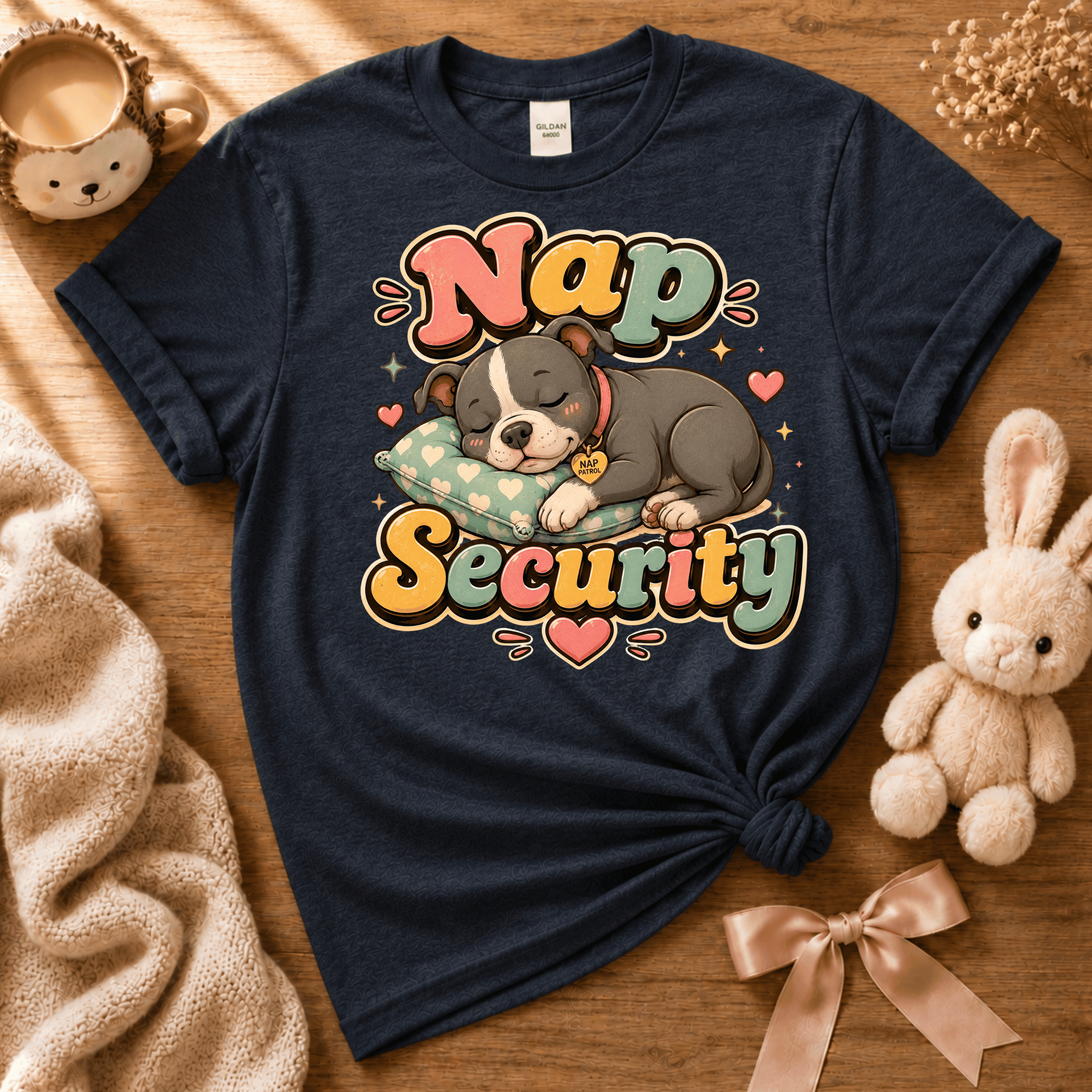Nap Security cute animal graphic t-shirt displayed in a cozy flat lay in navy.