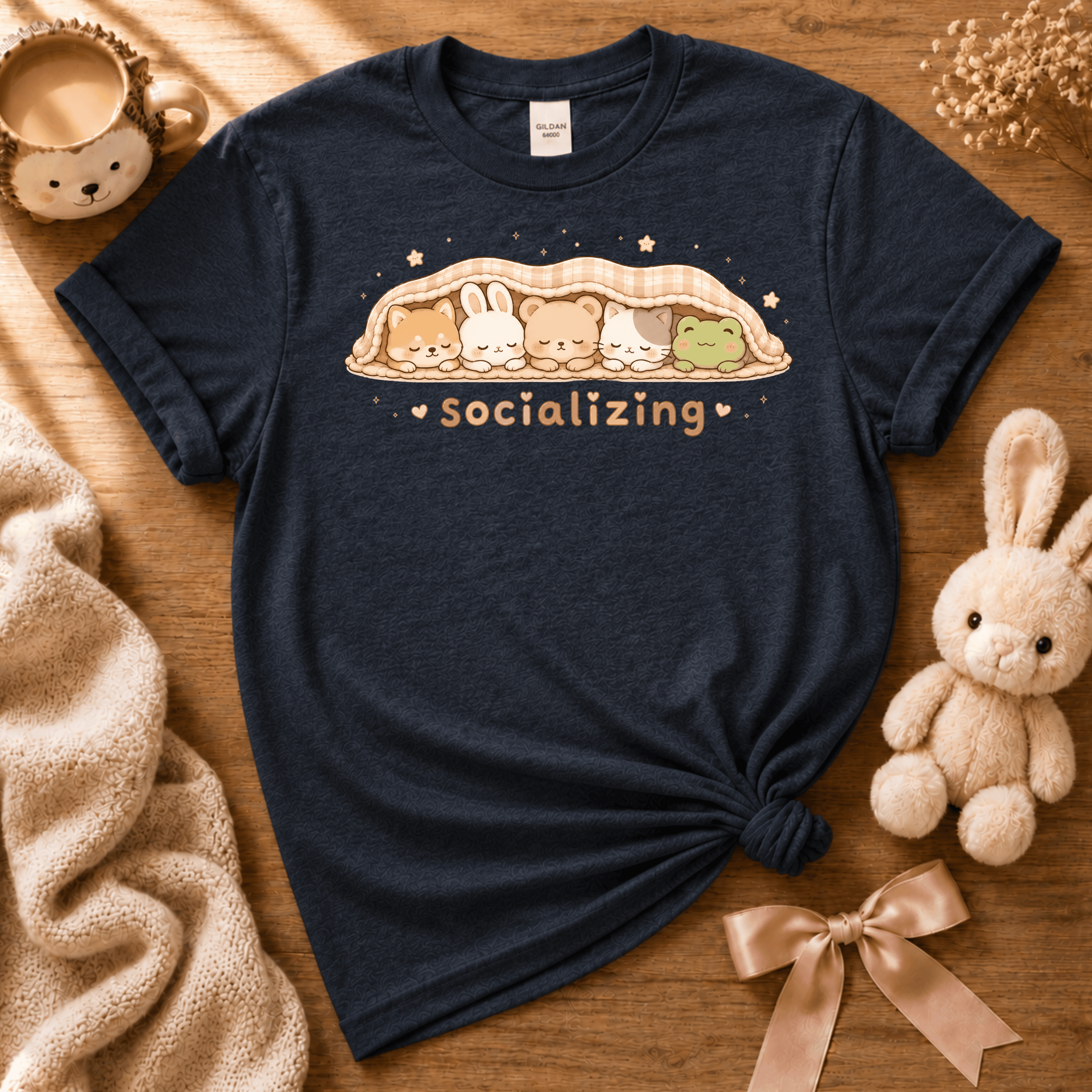 Socializing cute animals graphic t-shirt cozy flat lay in navy.
