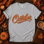 October Premium T-Shirt in athletic heather gray, flat lay with autumn props
