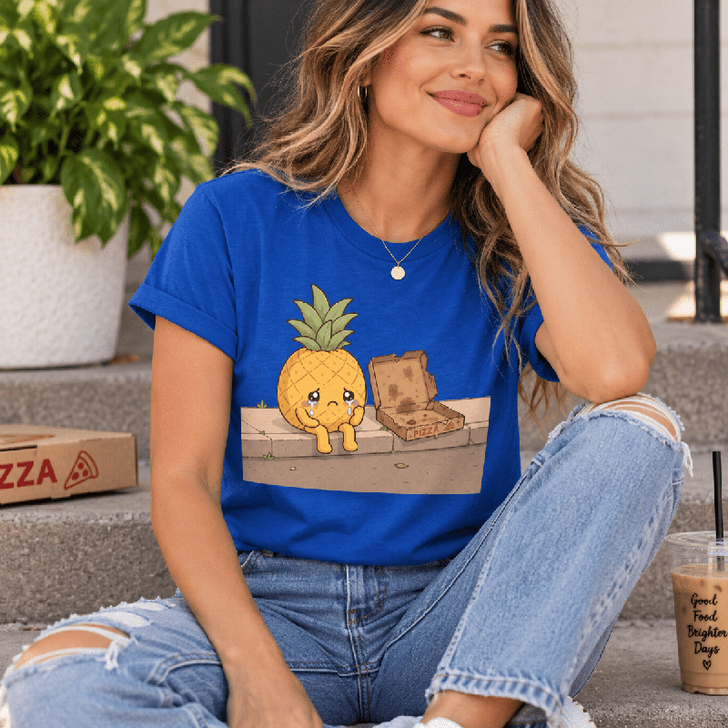 Woman sitting on steps, wearing the Pineapple Pizza Premium T-Shirt in true royal blue