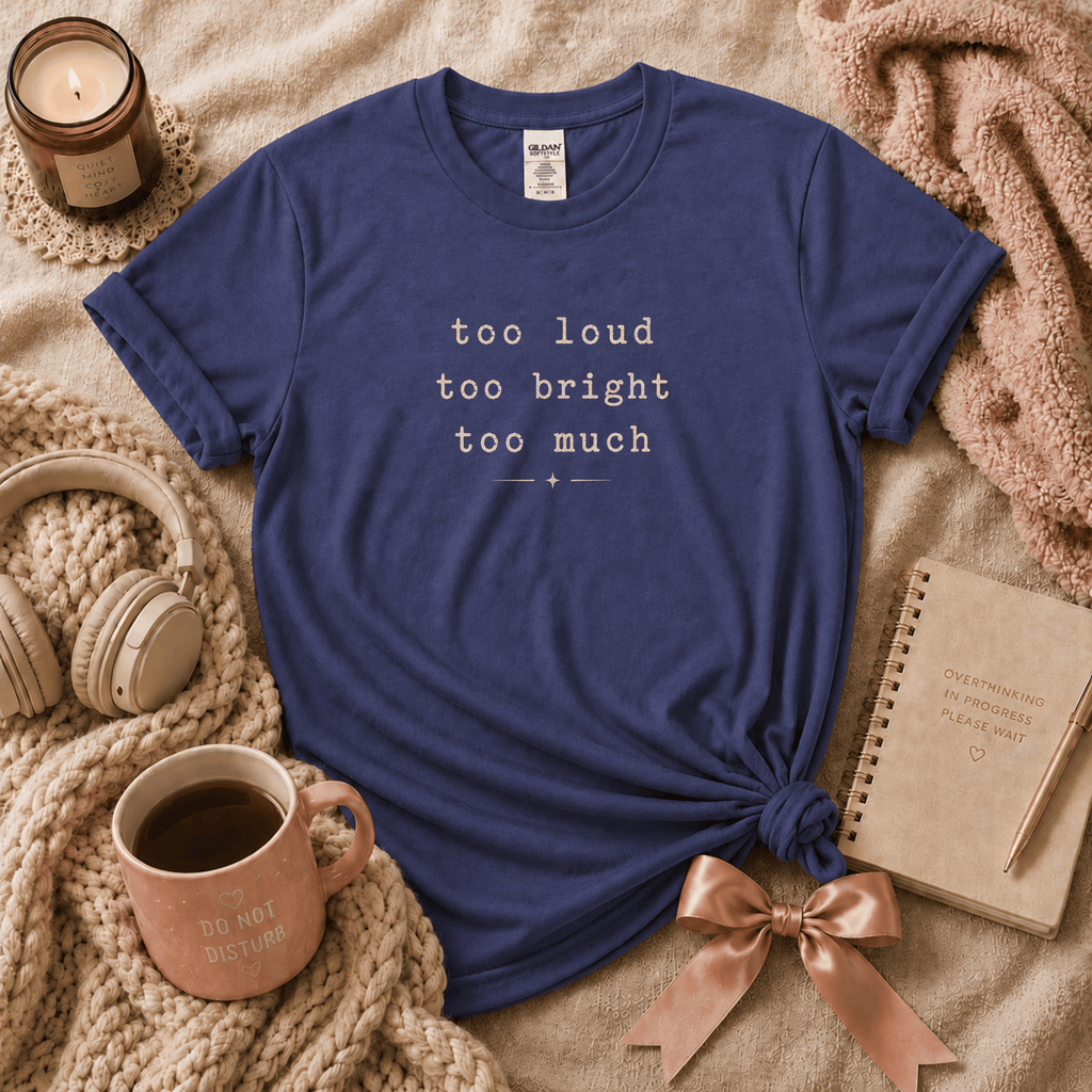 Too Much introvert graphic t-shirt cozy flat lay in purple.