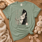 Observing cute animal graphic t-shirt cozy flat lay in sage.